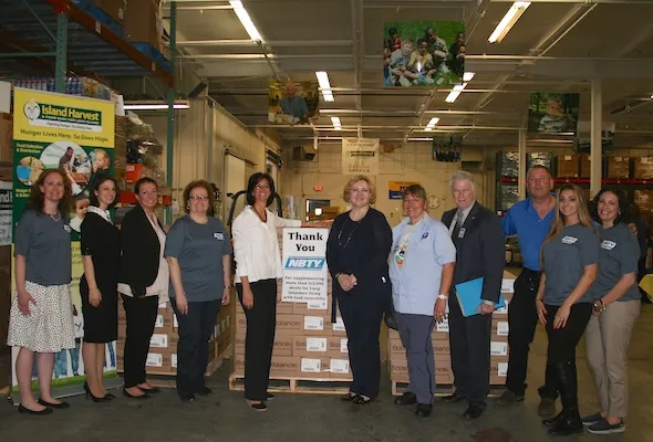 NBTY donates nutrition bars to local food bank