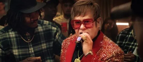 Elton John takes on rap music in new Snickers ad